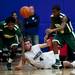 Pioneer High School senior Aedan York passes while falling to the ground on Friday, Jan. 18. Daniel Brenner I AnnArbor.com